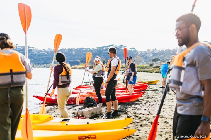a group of people that are standing in the water